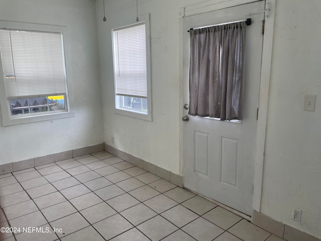 entrance foyer with light tile patterned floors