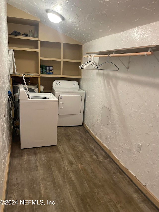 laundry room featuring built in features, dark hardwood / wood-style floors, and separate washer and dryer