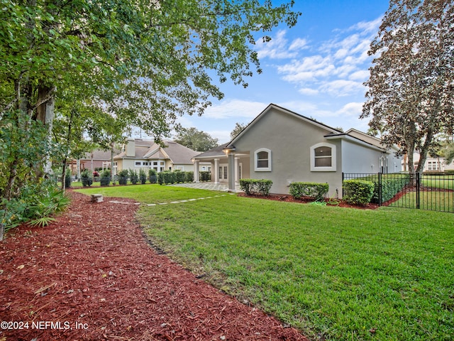 rear view of house with a yard