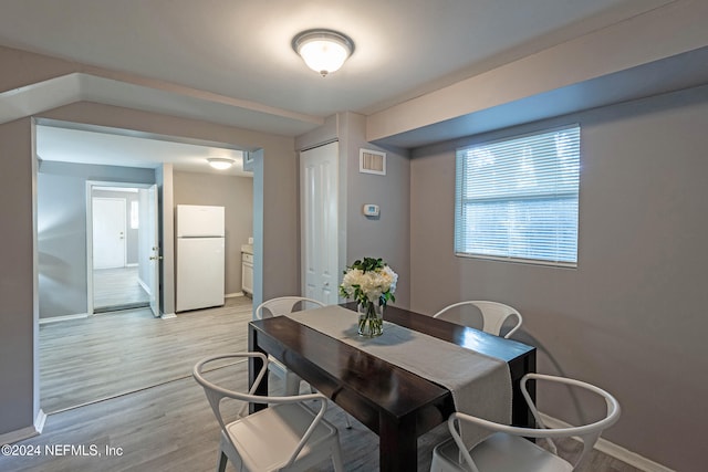 dining room with light wood-type flooring