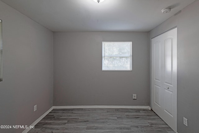 spare room with hardwood / wood-style floors