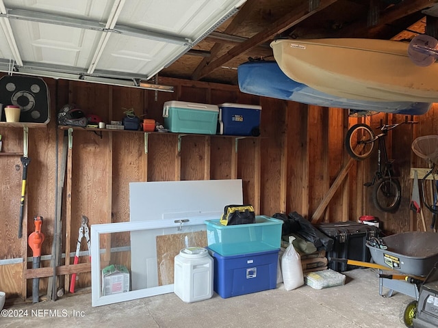 garage featuring wooden walls