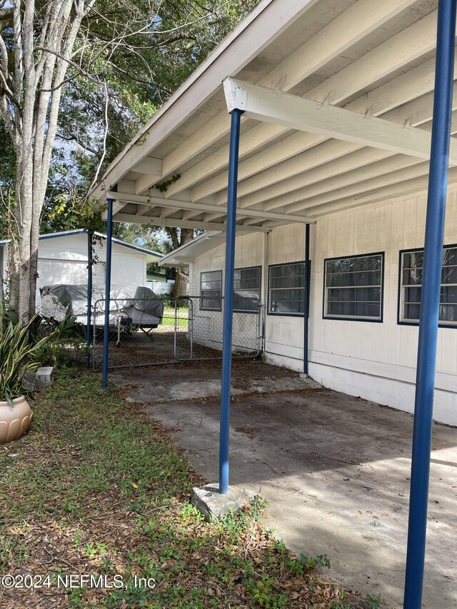 1425 Domas Dr, Jacksonville, FL 32211 - view of car parking featuring a carport