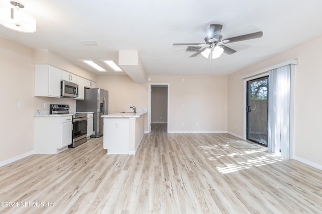 kitchen featuring sink, appliances with stainless steel finishes, ceiling fan, white cabinets, and light wood-type flooring