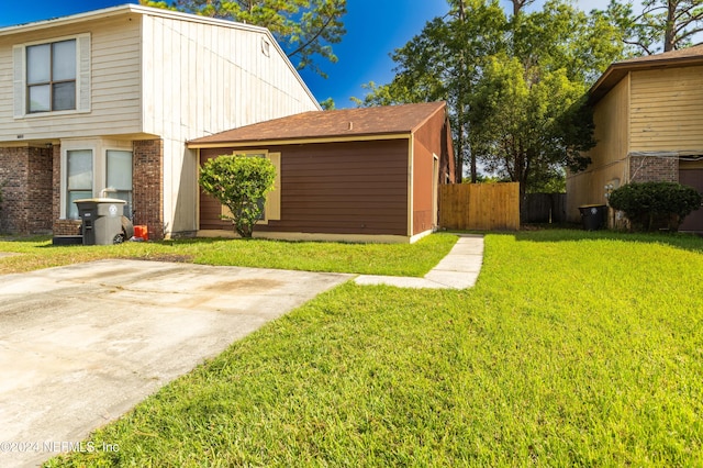 view of home's exterior featuring a yard