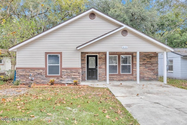 bungalow-style home featuring a porch and a front lawn