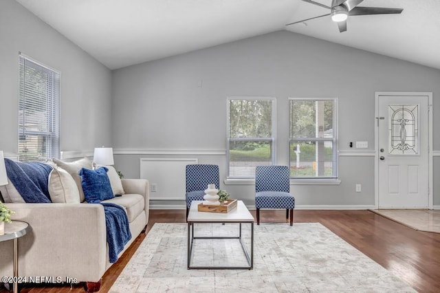 sitting room featuring hardwood / wood-style flooring, ceiling fan, and vaulted ceiling