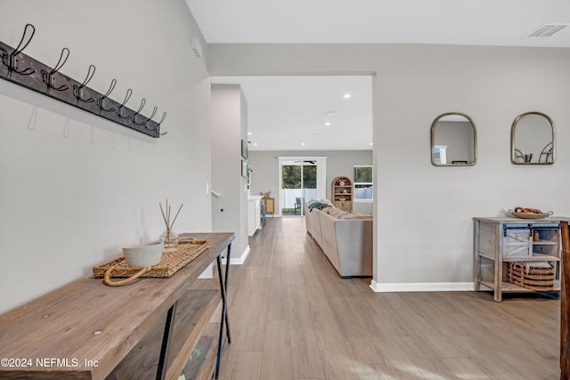 hall with light wood-type flooring