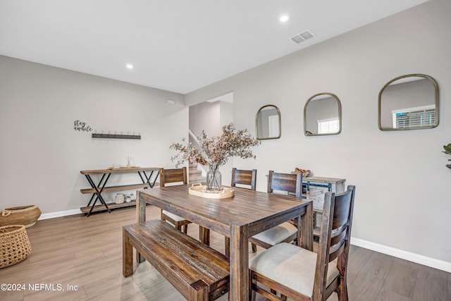 dining room with wood-type flooring