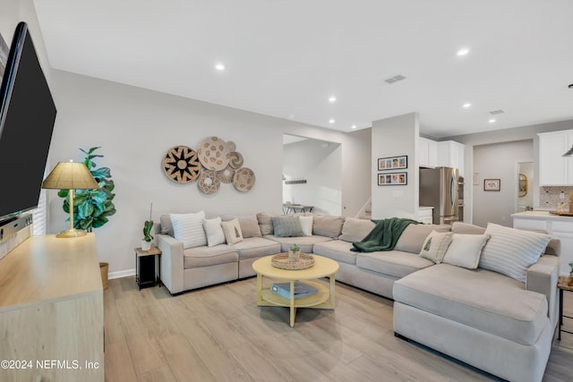 living room with light hardwood / wood-style floors