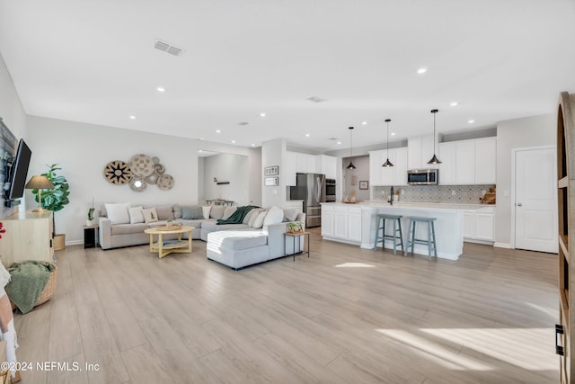 living room featuring light wood-type flooring