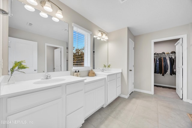 bathroom featuring tile patterned floors and vanity