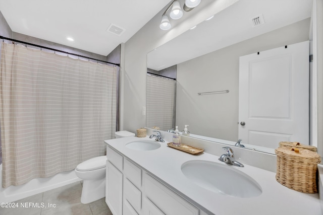 full bathroom featuring tile patterned flooring, vanity, shower / tub combo with curtain, and toilet