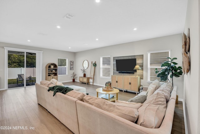 living room with light hardwood / wood-style flooring