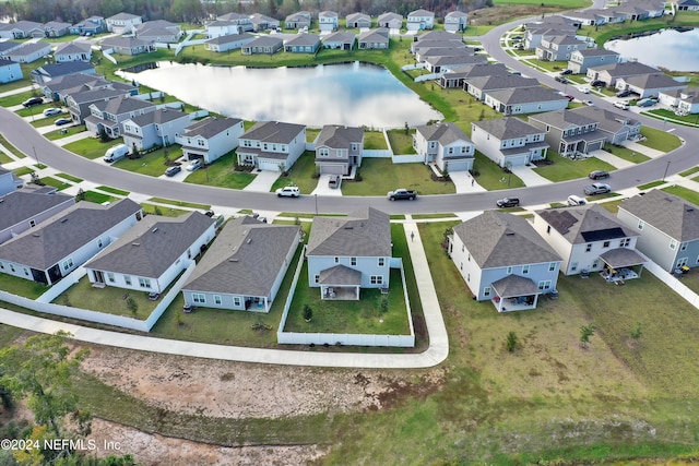 drone / aerial view with a water view