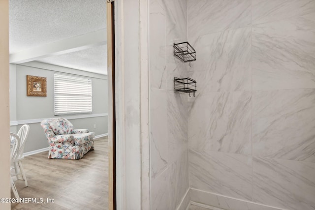 bathroom with hardwood / wood-style flooring