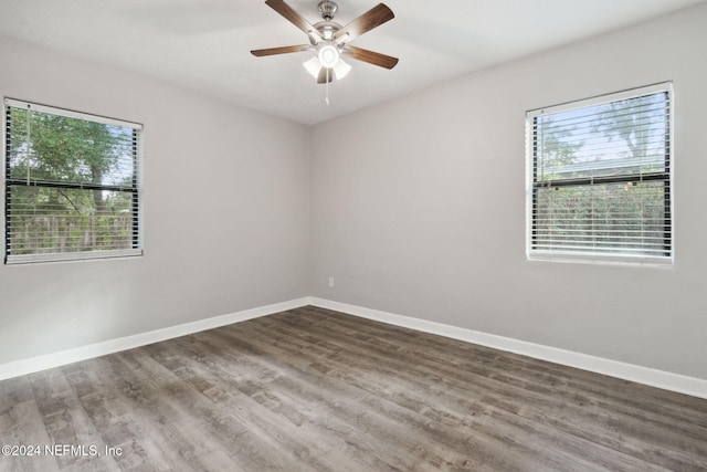 empty room featuring ceiling fan and wood-type flooring