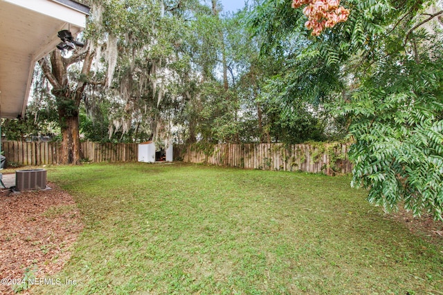 view of yard featuring central AC unit