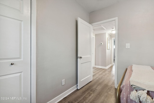 bedroom with hardwood / wood-style floors