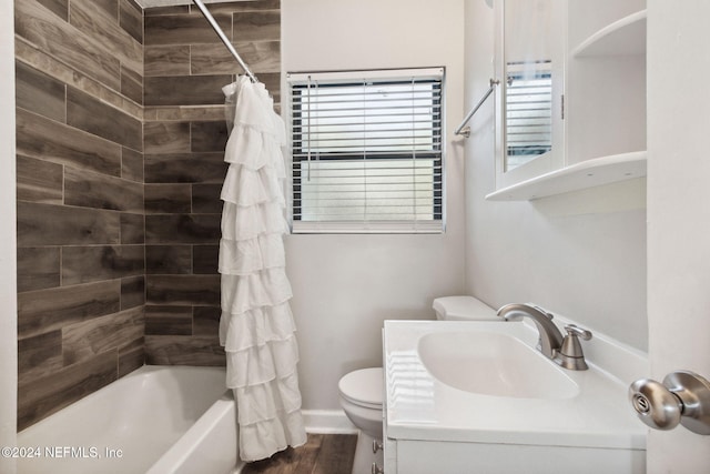 full bathroom featuring shower / bath combo with shower curtain, wood-type flooring, sink, and toilet