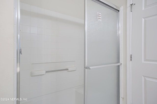 bathroom featuring an enclosed shower