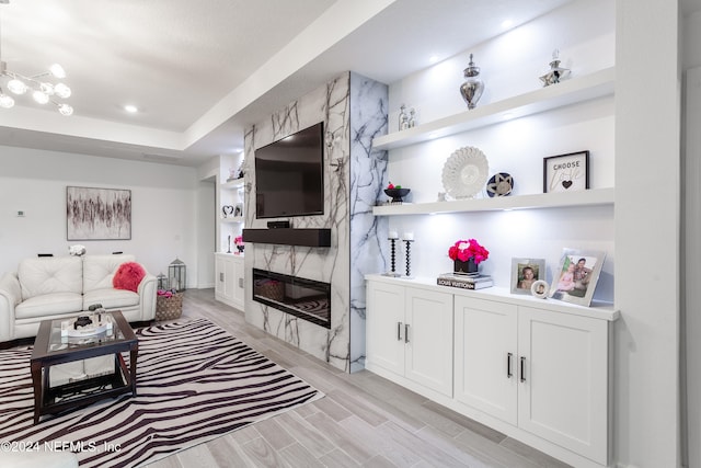 living room featuring a fireplace and built in features