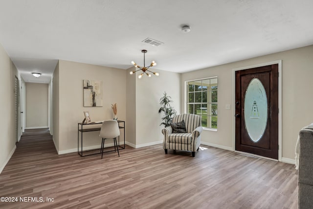 foyer featuring a notable chandelier and light wood-type flooring