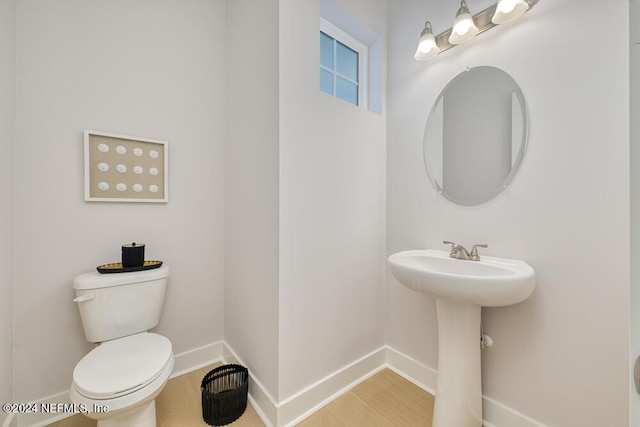 bathroom featuring toilet and sink