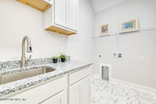 laundry room featuring cabinets, hookup for a washing machine, electric dryer hookup, and sink