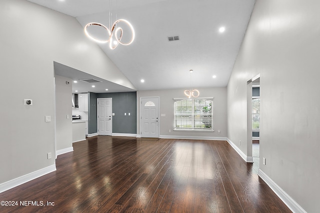 unfurnished living room with hardwood / wood-style flooring and high vaulted ceiling