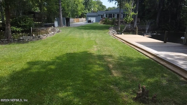 view of yard with a wooden deck