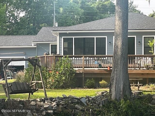 rear view of property with a deck