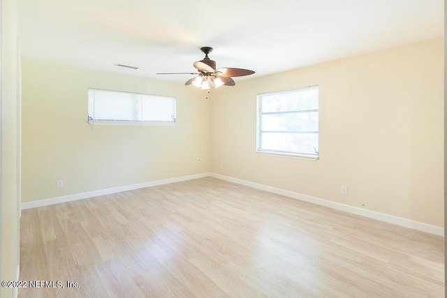 unfurnished room with ceiling fan and light hardwood / wood-style flooring