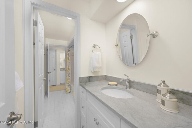 bathroom with tile patterned flooring and vanity