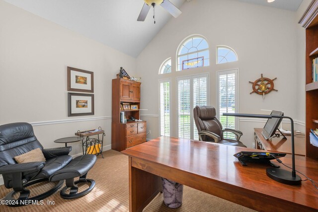 office space with high vaulted ceiling, a wealth of natural light, and ceiling fan