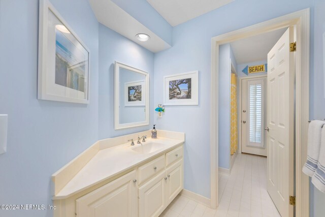 bathroom with tile patterned flooring and vanity