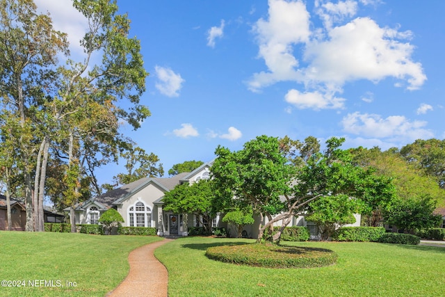 view of front of house with a front lawn