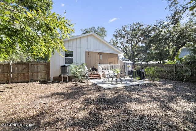 view of yard featuring a patio area and central air condition unit