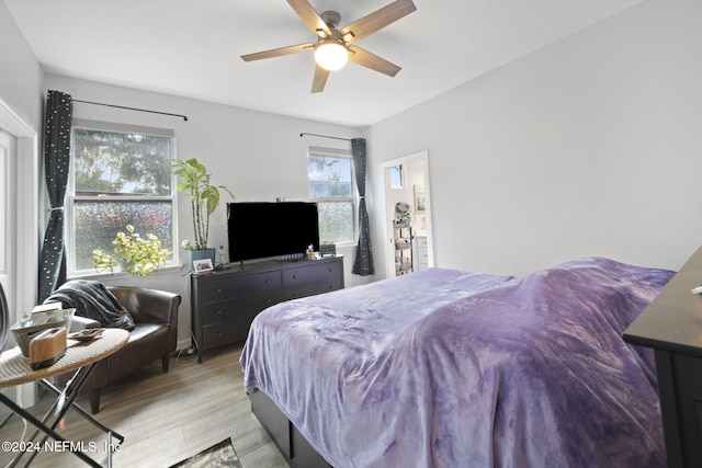 bedroom featuring light hardwood / wood-style flooring and ceiling fan