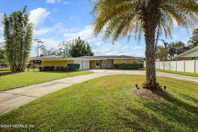 single story home with a front lawn