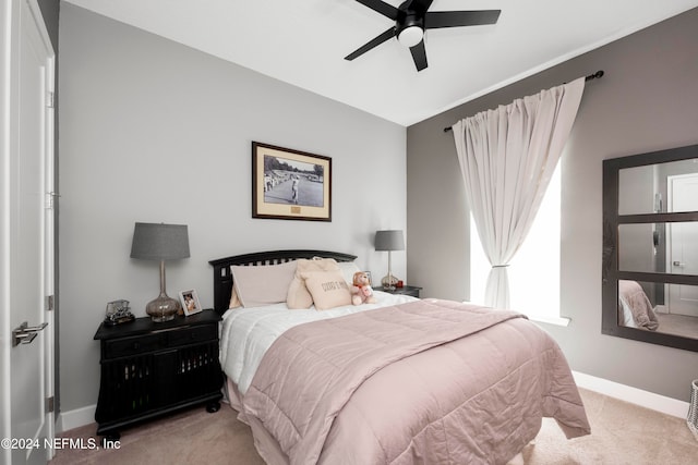 carpeted bedroom with lofted ceiling and ceiling fan