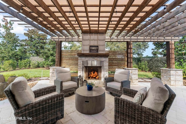 view of patio / terrace with an outdoor living space with a fireplace and a pergola