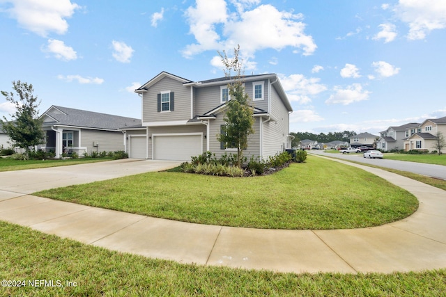 front of property featuring a garage and a front yard