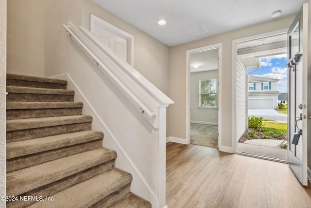 entryway with light hardwood / wood-style flooring