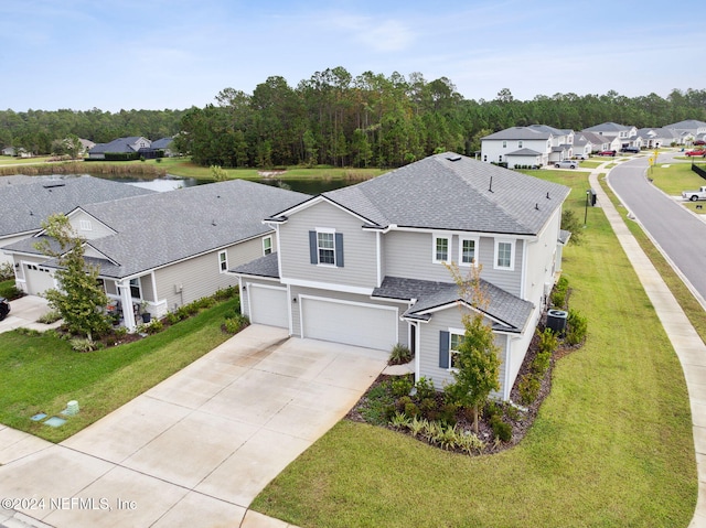 view of front facade with a garage and a front lawn