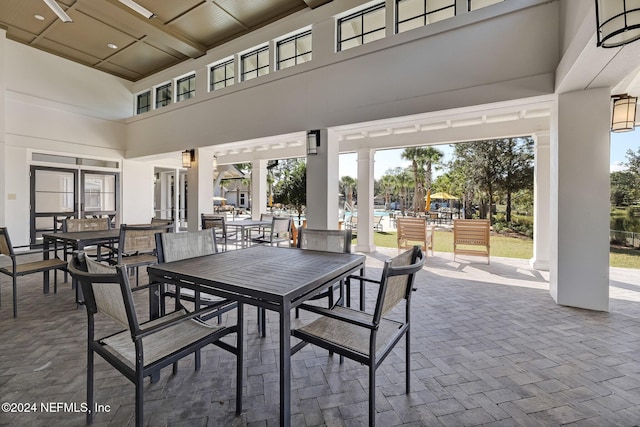 dining room featuring a towering ceiling