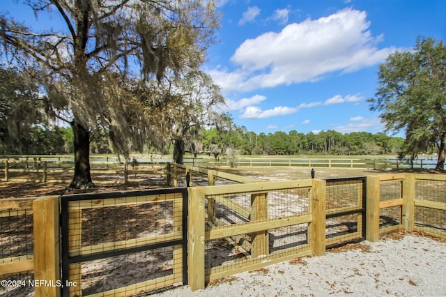 view of gate featuring a rural view