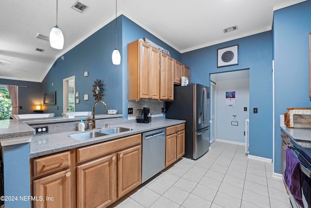 kitchen featuring vaulted ceiling, sink, pendant lighting, crown molding, and stainless steel appliances