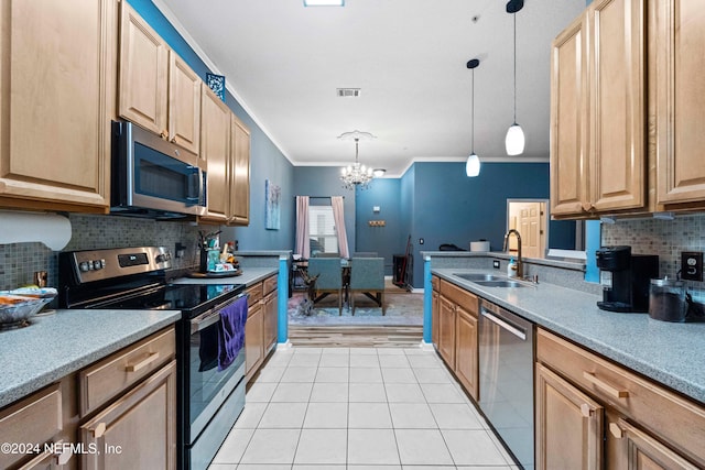 kitchen with hanging light fixtures, appliances with stainless steel finishes, a chandelier, ornamental molding, and sink