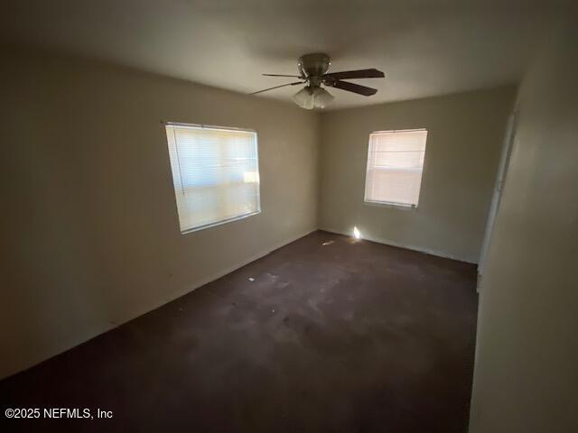 spare room with a ceiling fan